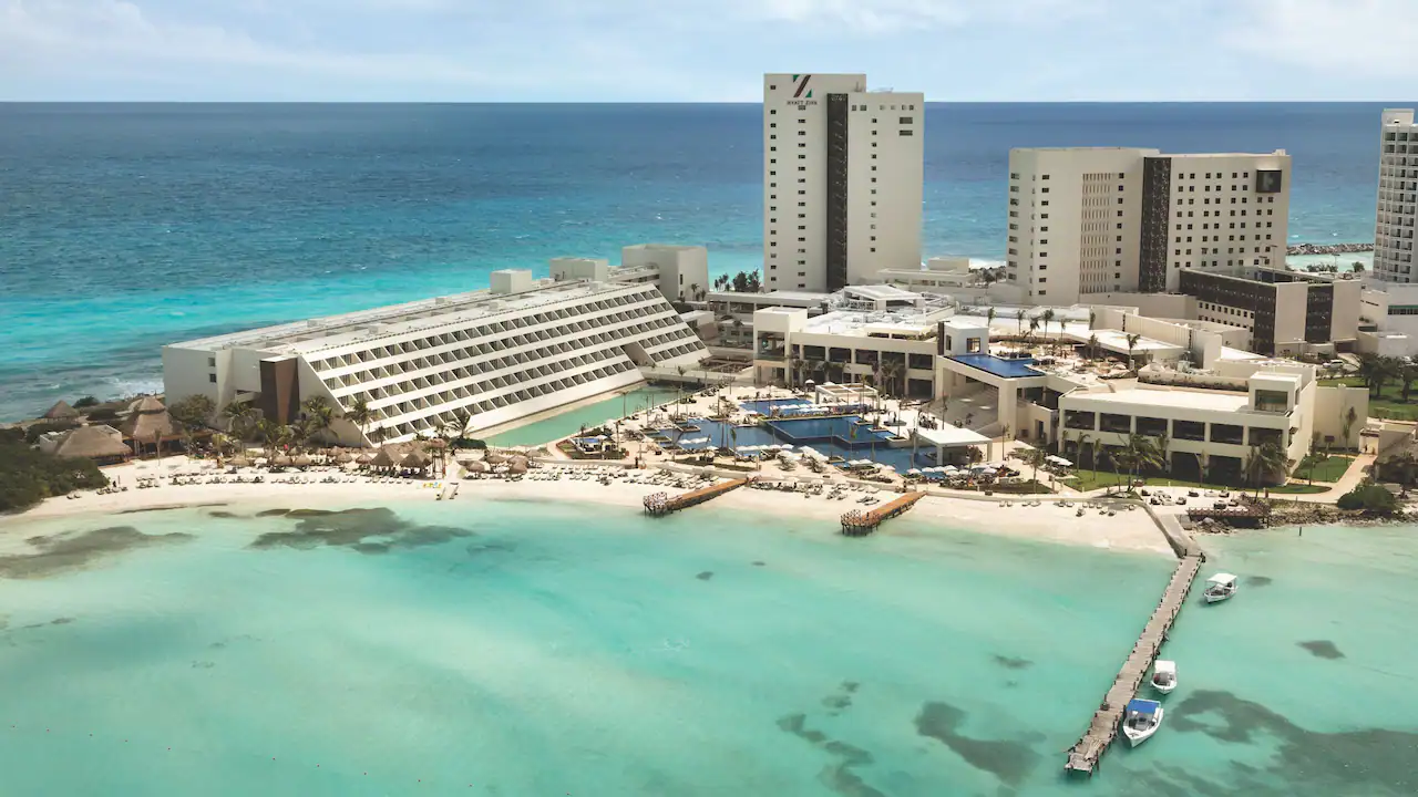 Hyatt Ziva Cancun family-friendly all-inclusive resort on a scenic peninsula with pools, beachfront views, and turquoise Caribbean water.