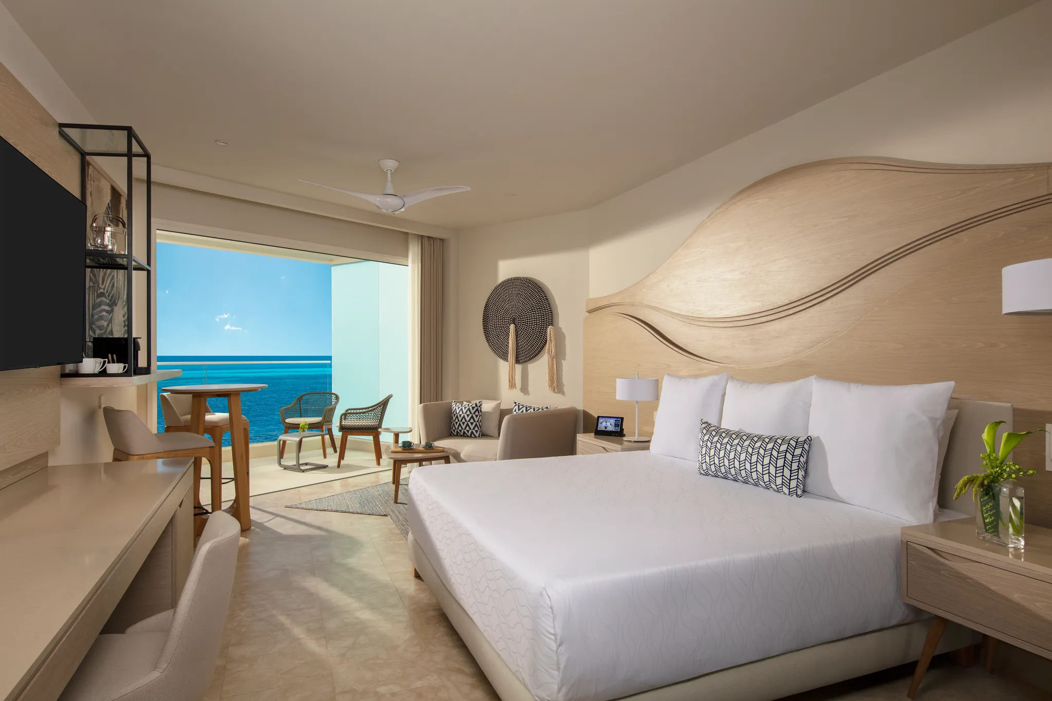 Allure Junior Suite Ocean View with king bed at Breathless Cancun Soul Resort overlooking the Caribbean Sea.