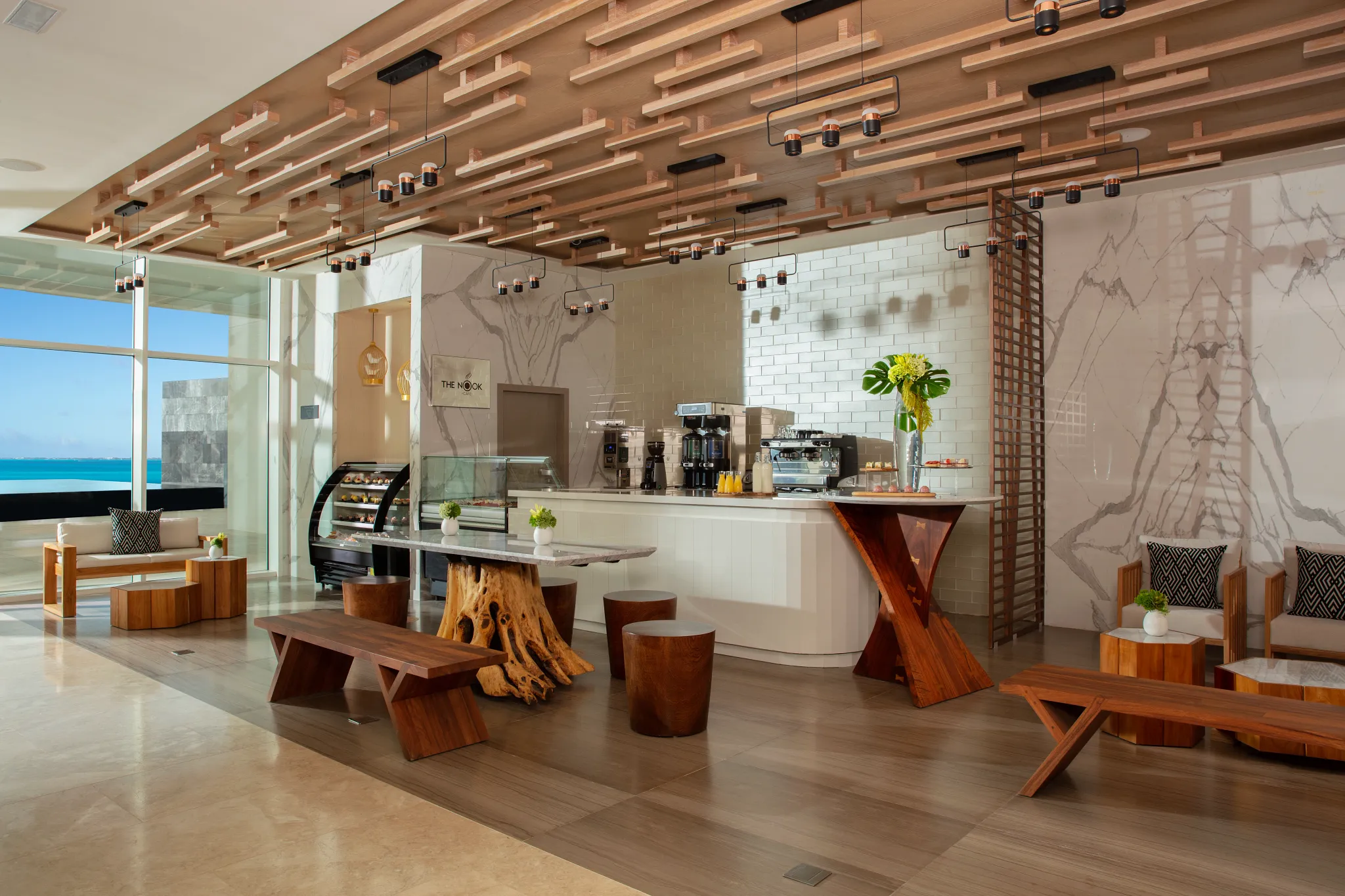 The Nook café at Breathless Cancun Soul with modern seating, coffee bar, and ocean views