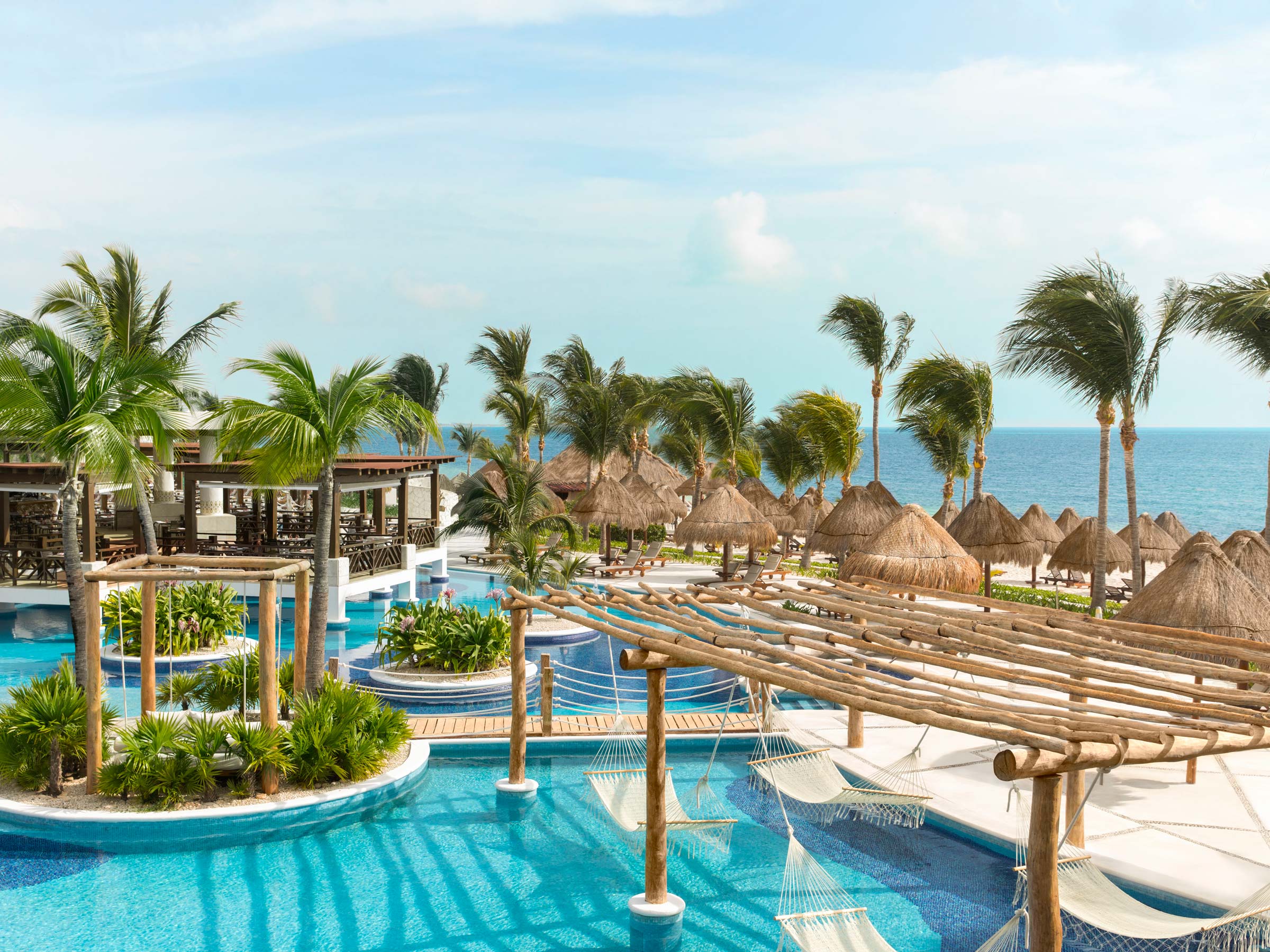 Excellence Playa Mujeres adults-only all-inclusive resort with beachfront suites and lagoon-style pools near Cancun, Mexico.