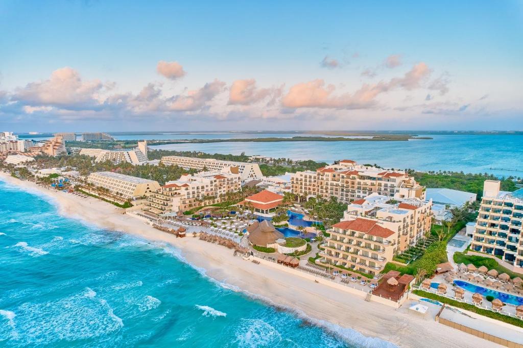 Fiesta Americana Condesa Cancun all-inclusive resort with beachfront pools and tropical landscaping in Cancun Hotel Zone.
