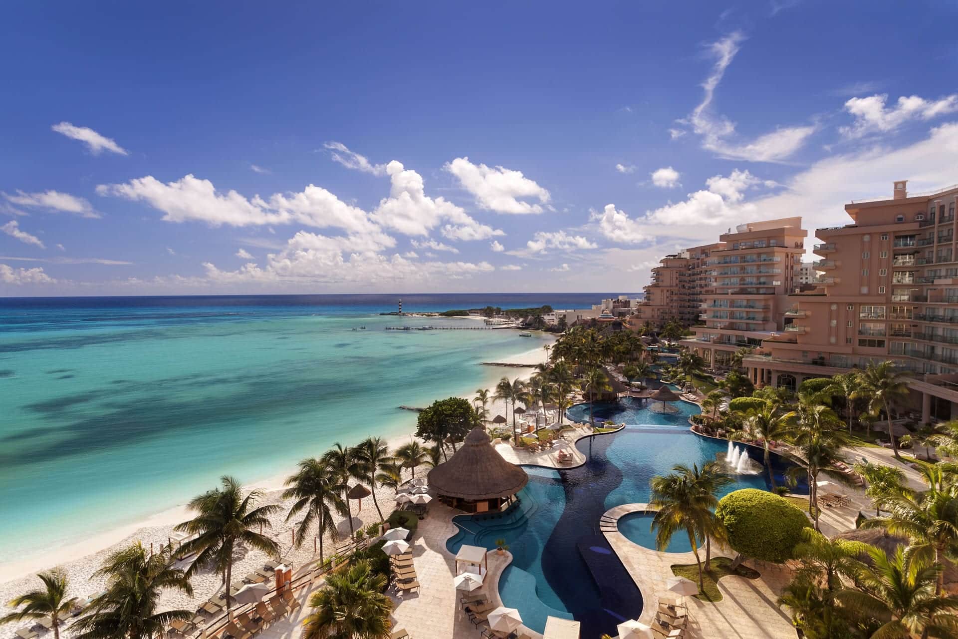 Grand Fiesta Americana Coral Beach Cancun luxury all-inclusive beachfront resort with pools and turquoise Caribbean Sea views.
