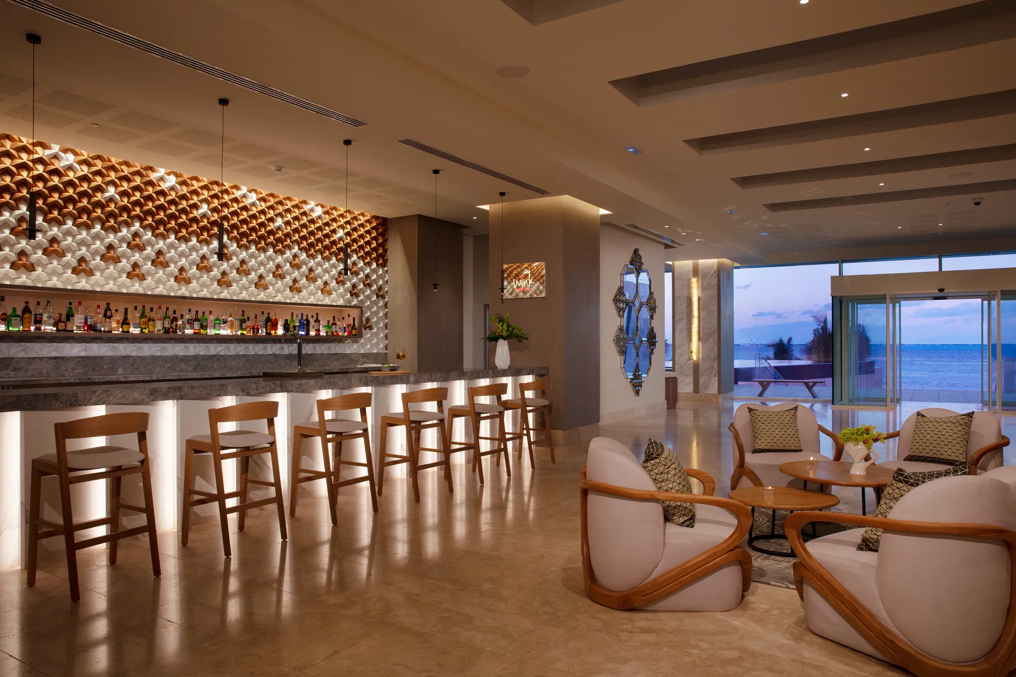 Wink Sports Bar at Breathless Cancun Soul with lounge seating, big screens, and modern bar design.