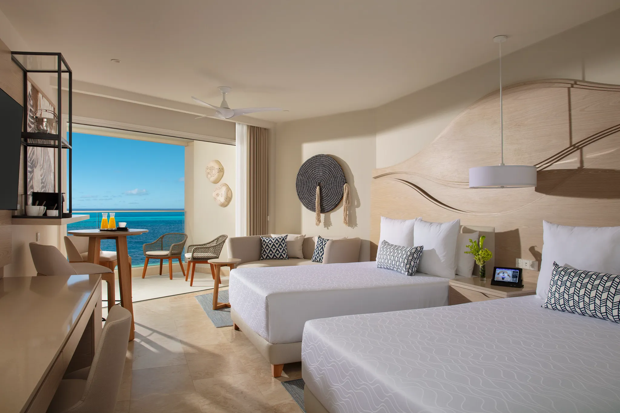 Xcelerate Junior Suite Ocean View with double beds at Breathless Cancun Soul Resort and Caribbean Sea views.