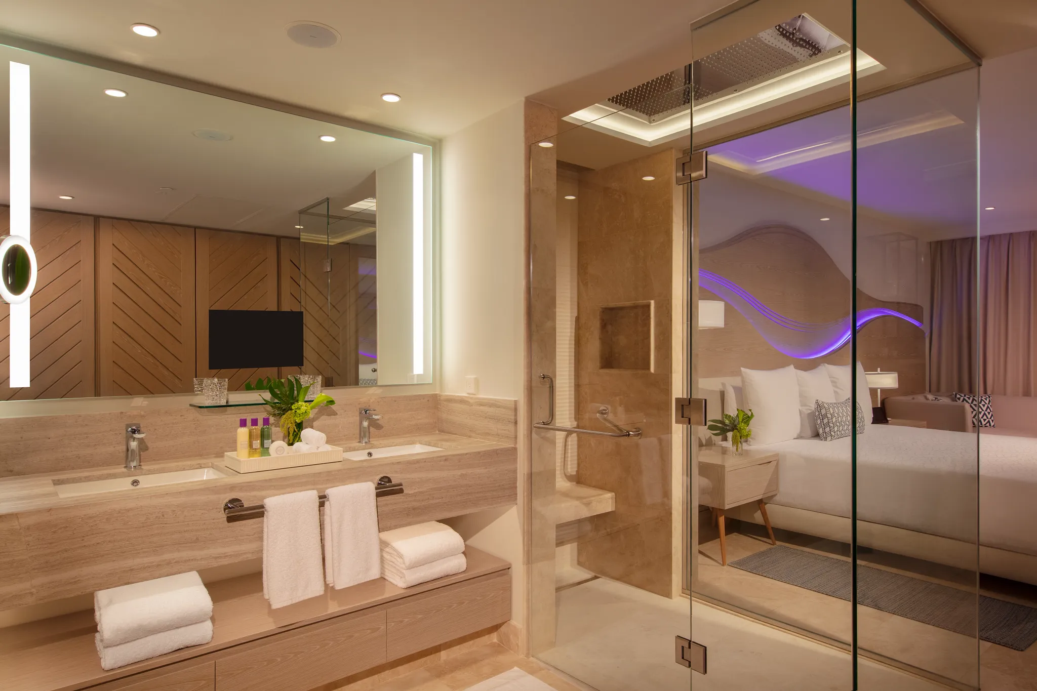 Luxury bathroom in the Xhale Club Junior Suite Ocean Front at Breathless Cancun Soul Resort with walk-in shower and modern finishes.