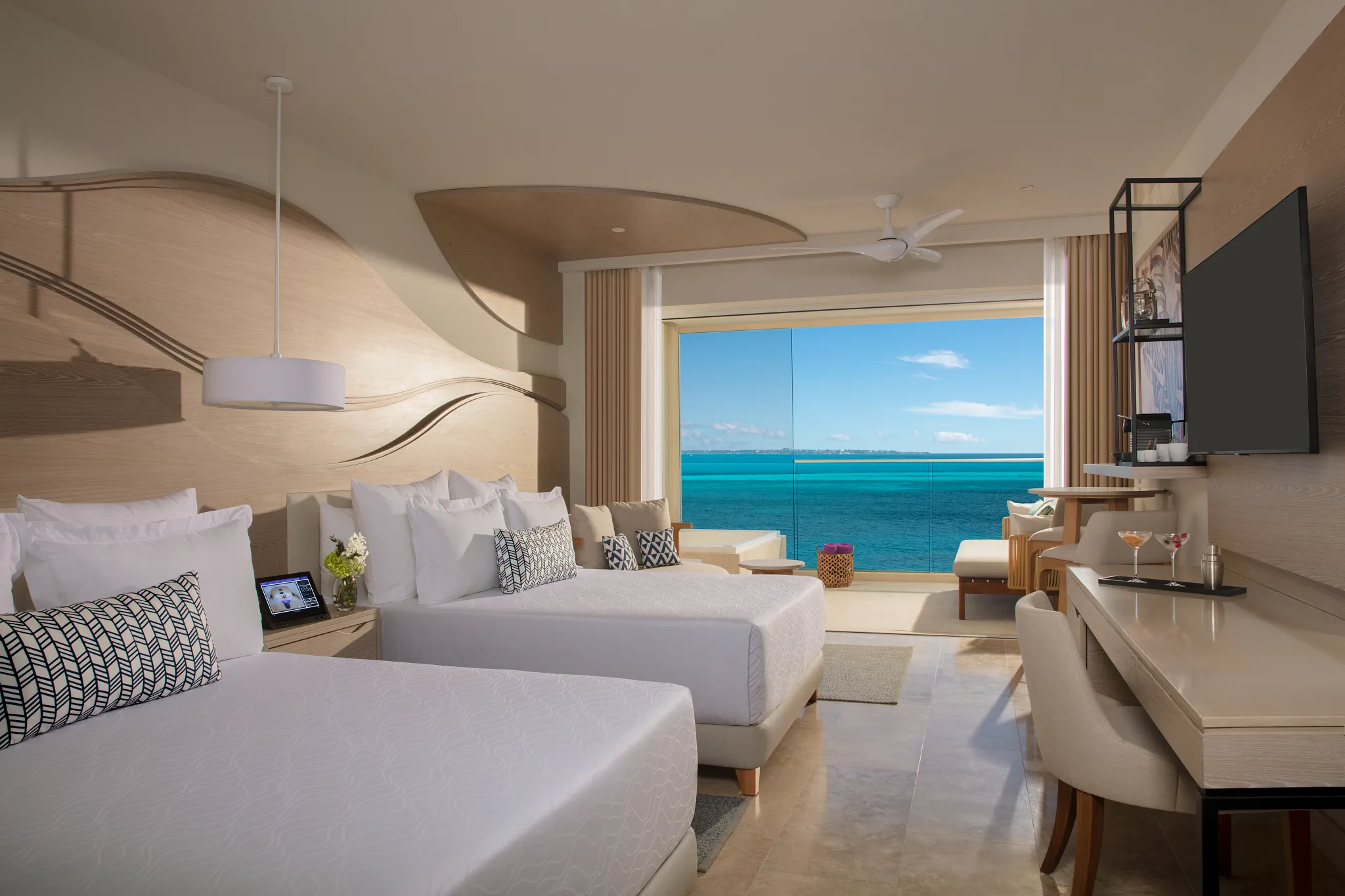 Double-bed Xhale Club Junior Suite Ocean Front at Breathless Cancun Soul Resort with private Jacuzzi terrace and ocean views.