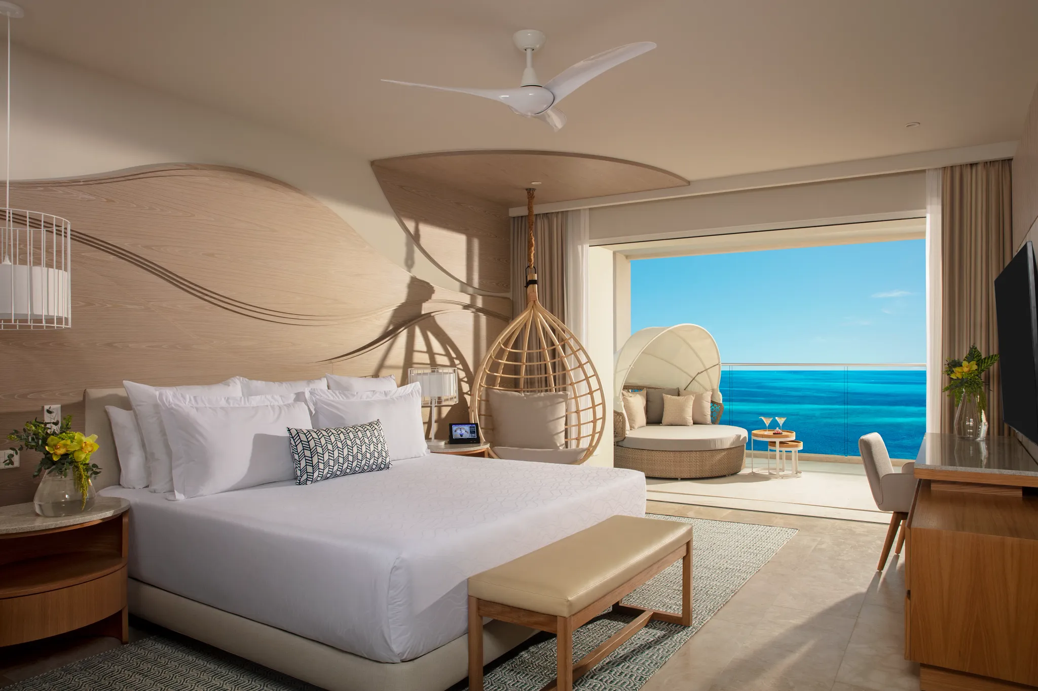 Ocean-front bedroom in the Xhale Club Master Suite at Breathless Cancun Soul Resort with king bed and Caribbean Sea views.