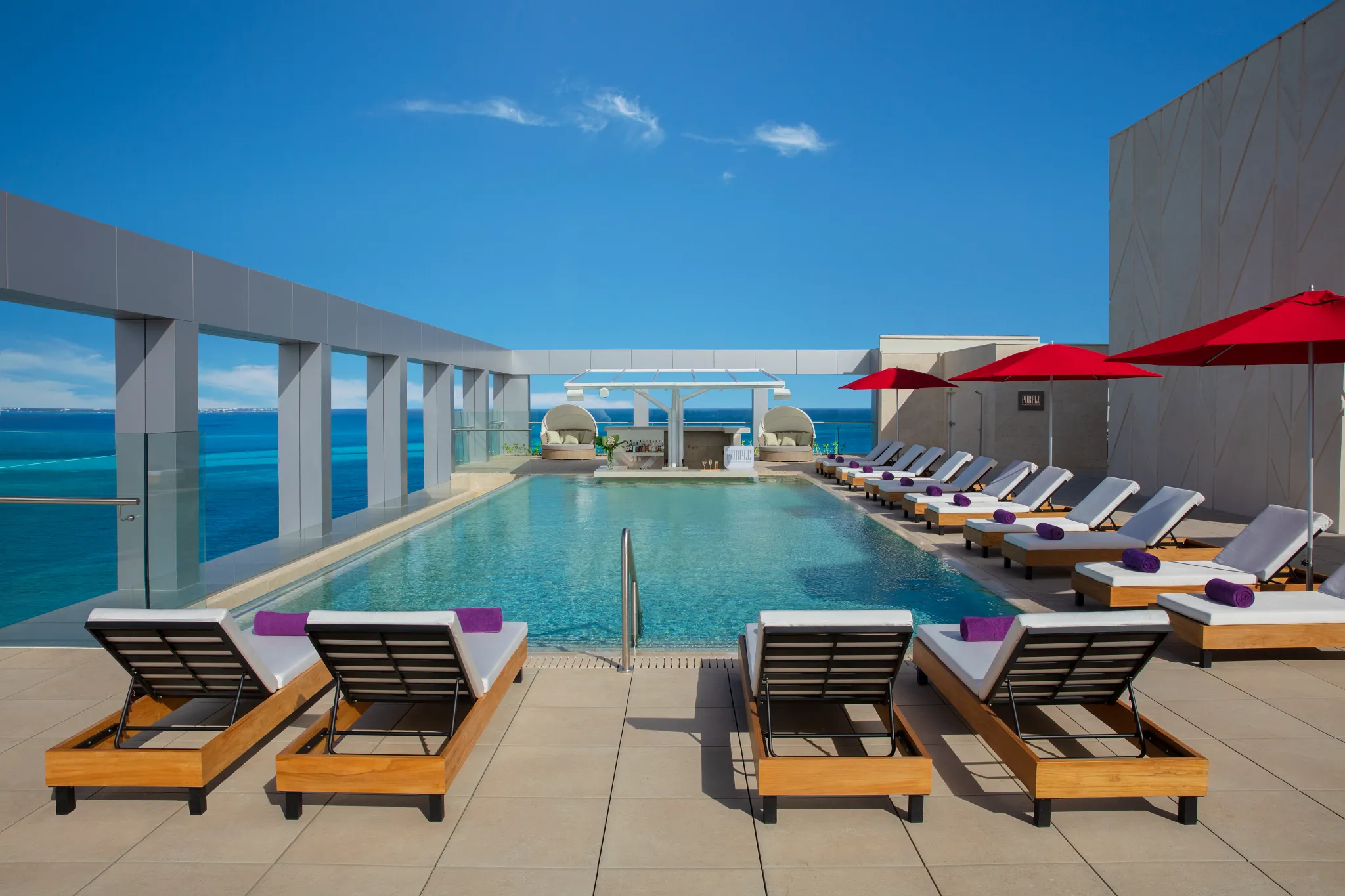 Xhale Club Pool at Breathless Cancun Soul with exclusive lounge seating and ocean-view infinity pool.